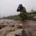 Refreshing water from stream of arctic hill Lapland